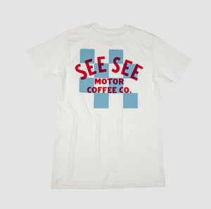 Back of white unisex t-shirt with white and blue checkered center on the back. Blue See See Motor Coffee Co. text overlay.