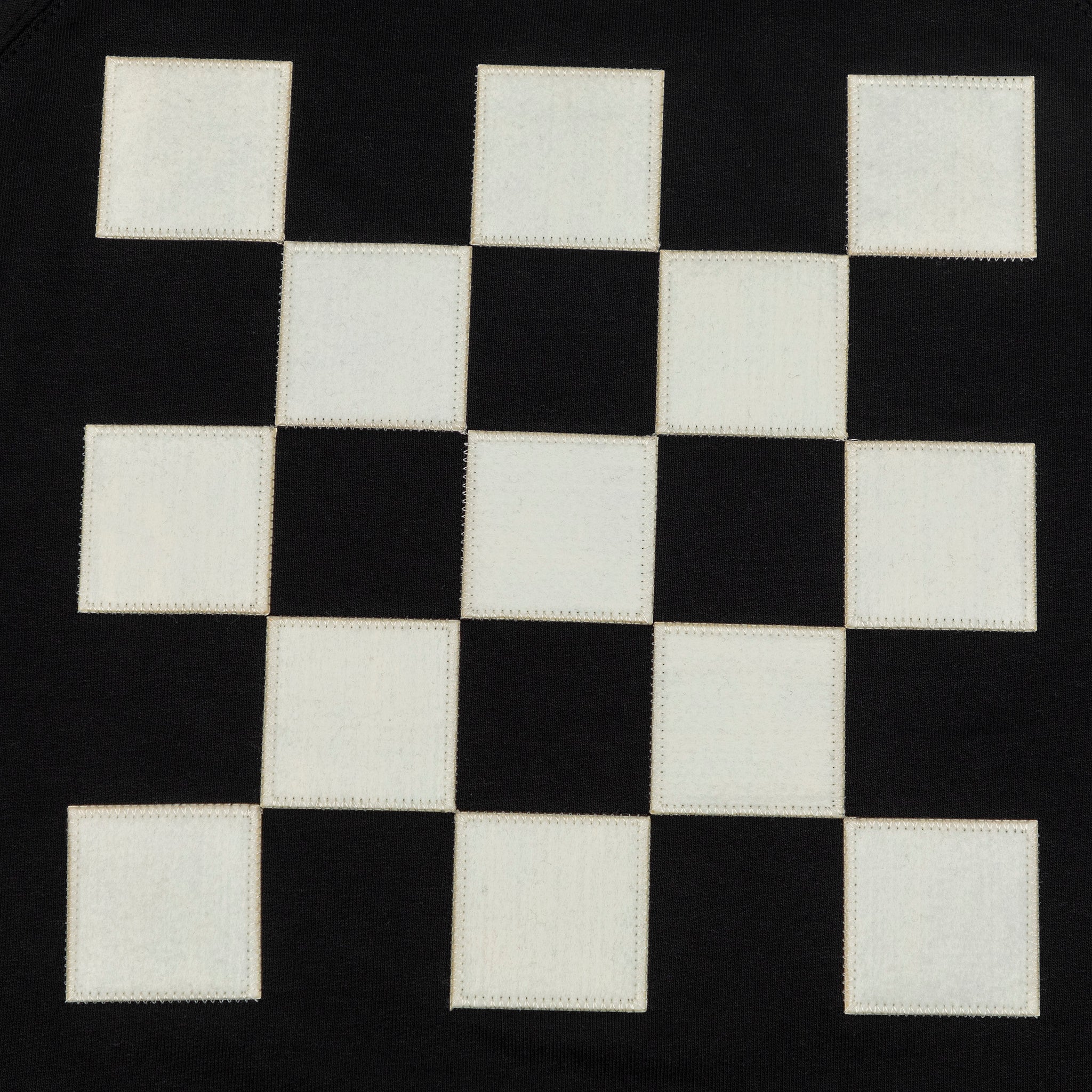 Back detailed shot of black and white checkered patch. 