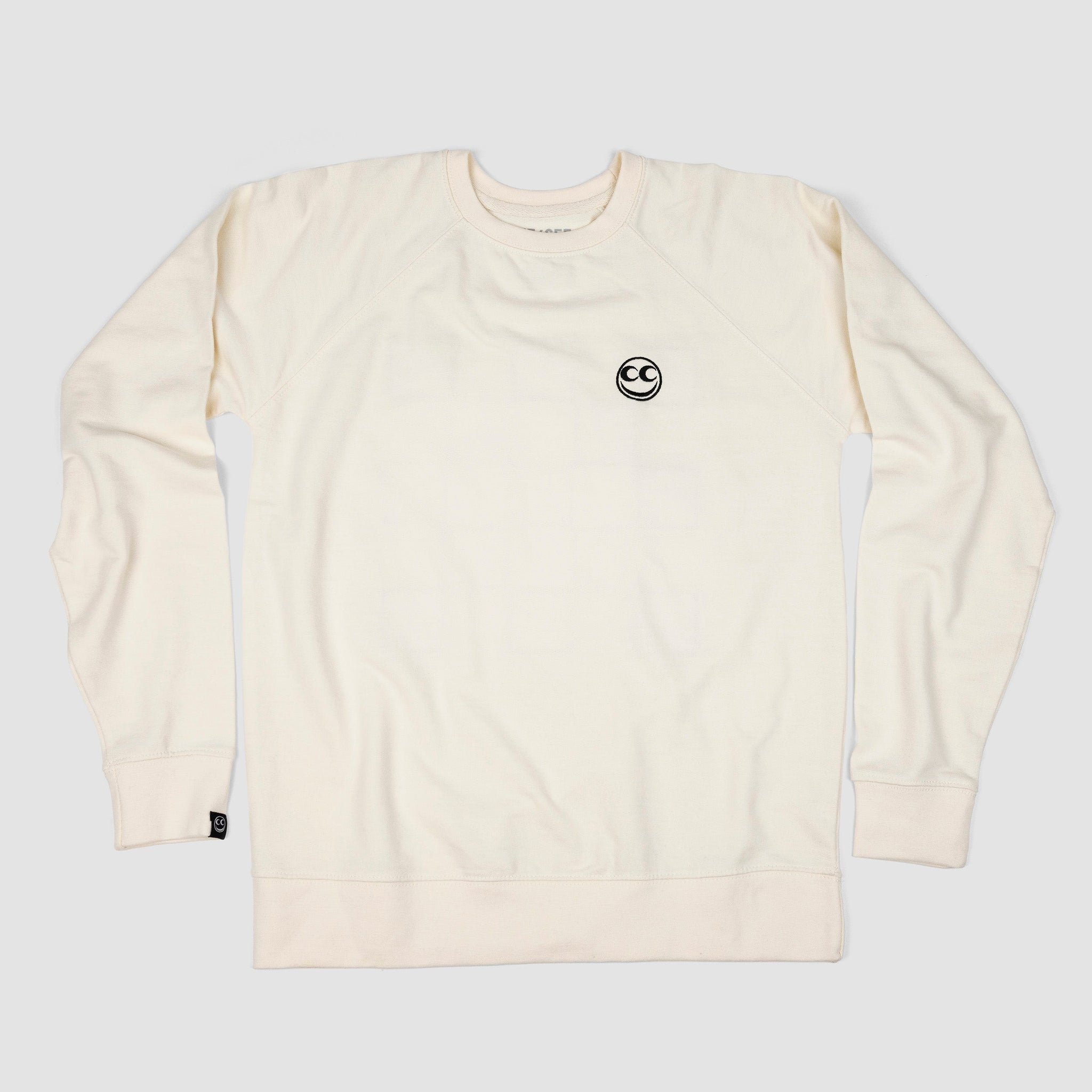 Front shot of bone white adult unisex premium crew sweatshirt with black Vern smiley overlay on left breast.