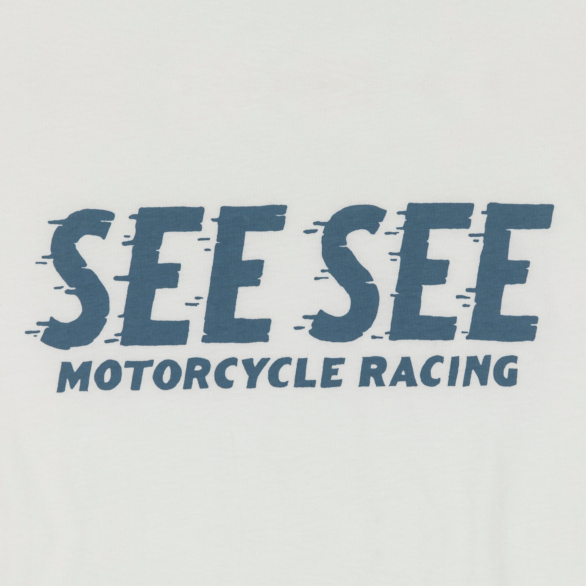 Front detailed shot of light blue See See Motorcycle Racing text overlay centered across the chest.