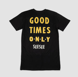 Back shot of black adult unisex t-shirt with yellow text centered. Text says, Good Times Only See See.